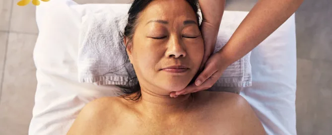 Asian Woman Enjoying Facial Massage Therapy